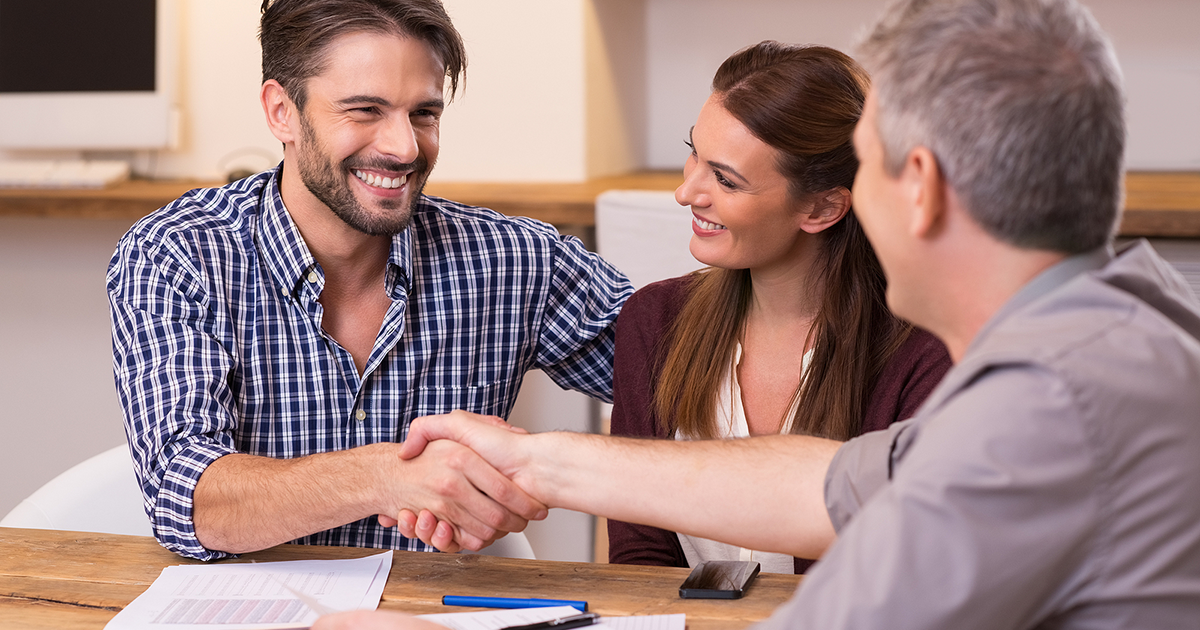 Businessmen handshake during meeting signing agreement.