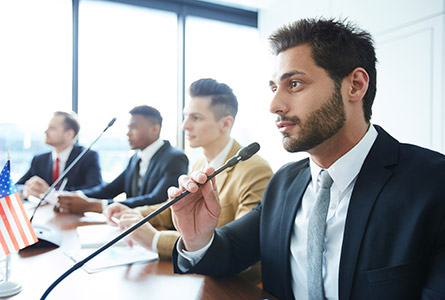 man speaking into a microphone