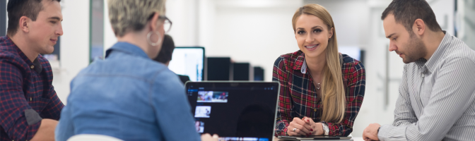 startup business team on meeting in modern bright office interior brainstorming, working on laptop and tablet computer