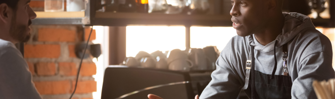 Restaurant worker owner interviewing new hire candidate for seasonal opening