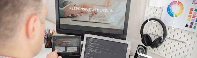 Designer working on responsive web design project.