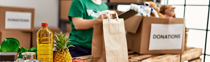 A person sorting donation items.