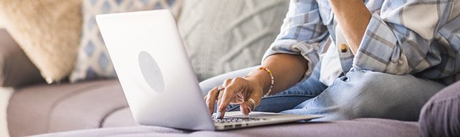 A person typing on a laptop.