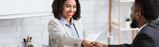 Two people shaking hands.