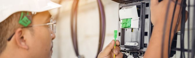 Technician installing fiber optic internet