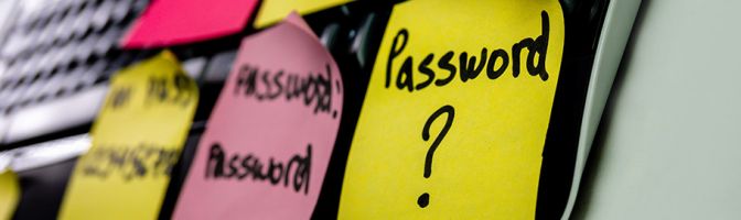 close up of a post-it not that has password? written on it
