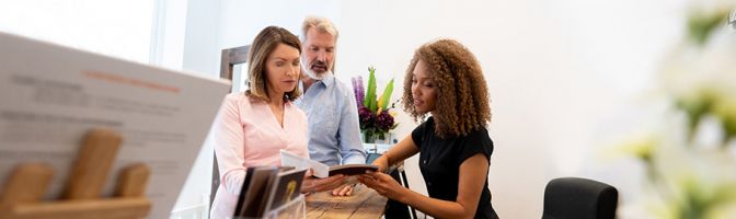 woman discussing something with a couple