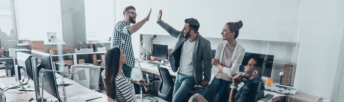 office team giving high fives