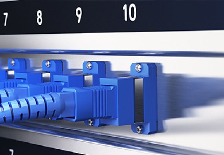 fiber-optic cables into a rack-mount router