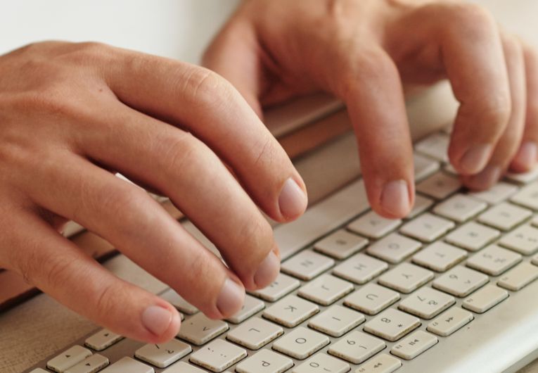 mans hands on keyboard