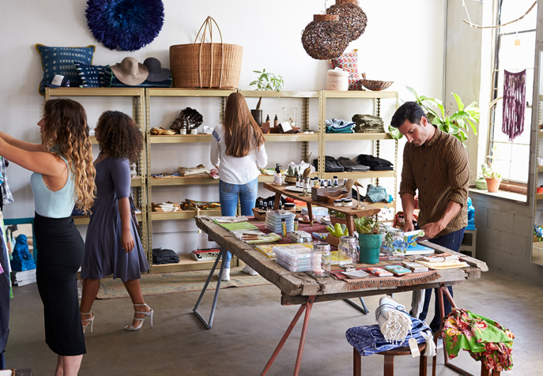 Customers and staff in a busy clothes shop