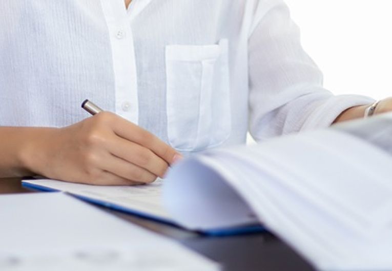 businesswomen checking document and using notebook working