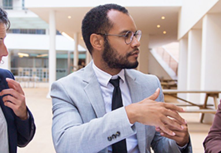 A group of business professionals having a discussion at a table.