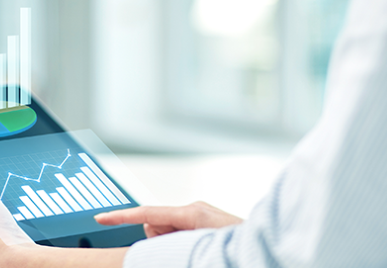 close up of woman with tablet showing growth charts at office