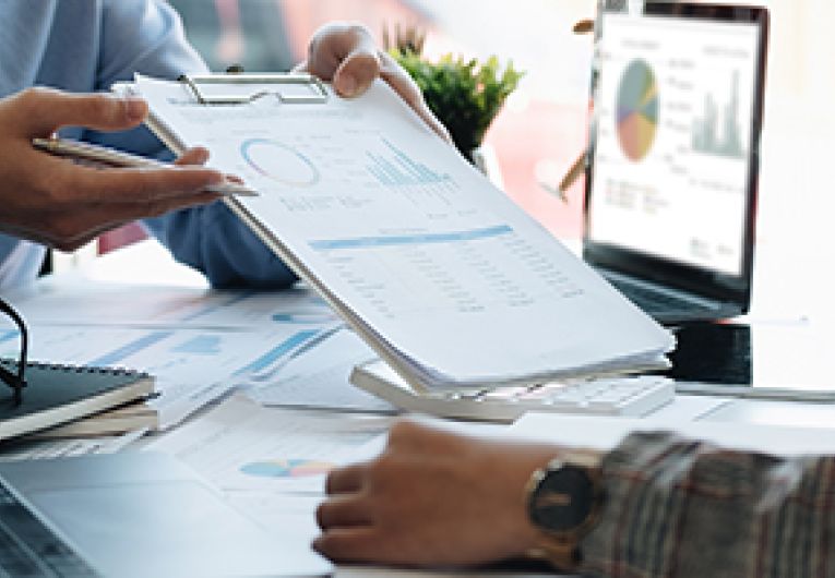Two small business partners discuss a growth strategy for their startup company.