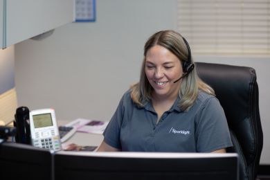 happy worker on computer