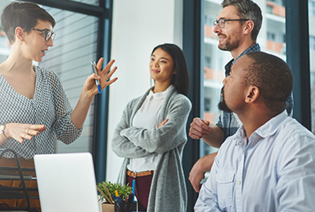 Business people focused on a woman speaking