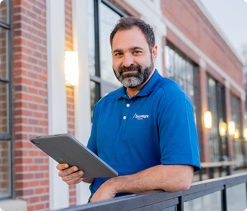 Man in a blue Sparklight branded shirt